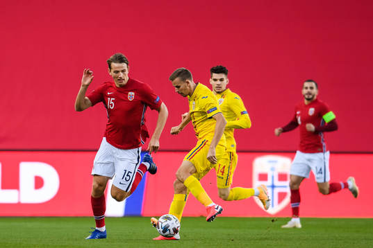 Sander Berge of Norway and Nicusor Bancu of Romania