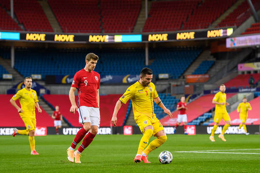 Alexander Sørloth of Norway and Alin Tosca of Romania