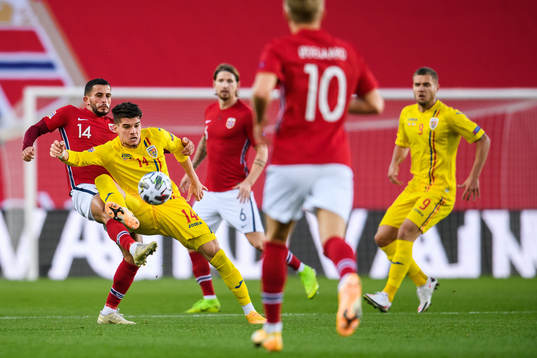 Omar Elabdellaoui of Norway and Ianis Hagi of Romania