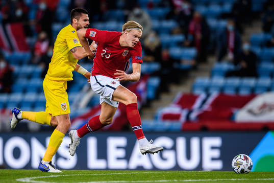 Andrei Burca of Romania and Erling Braut Haaland of Norway