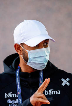 Joshua King of Norway arrives wearing a face mask