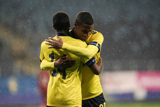 Paulos Abraham and Amin Sarr of Sweden celebrate the 9-0