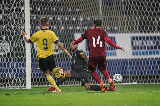 Jesper Karlsson of Sweden scores the 3-0 goal