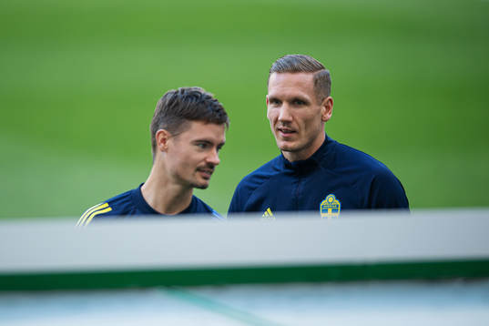 Mikael Lustig and goalkeeper Robin Olsen of the Swedish