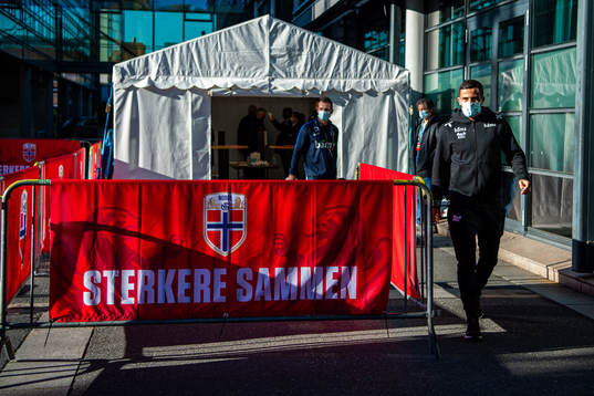 Omar Elabdellaoui arrives wearing a face mask