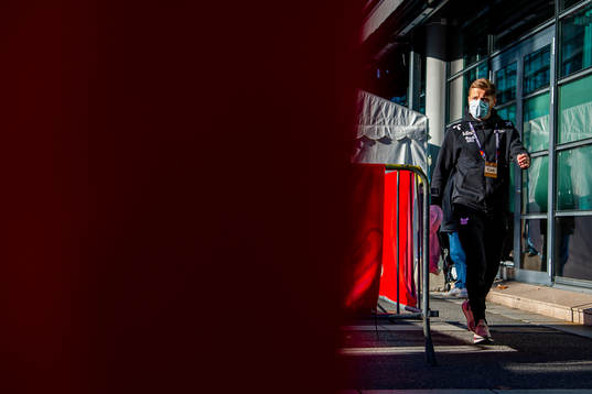 Fredrik Midtsjø arrives wearing a face mask