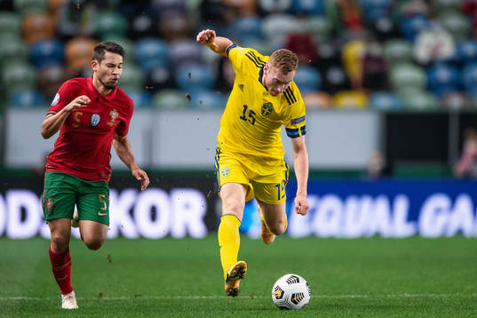 Raphael Guerreiro of Portugal and Dejan Kulusevski of Sweden