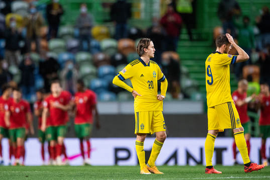 Kristoffer Olsson and Marcus Berg of Sweden looks dejected