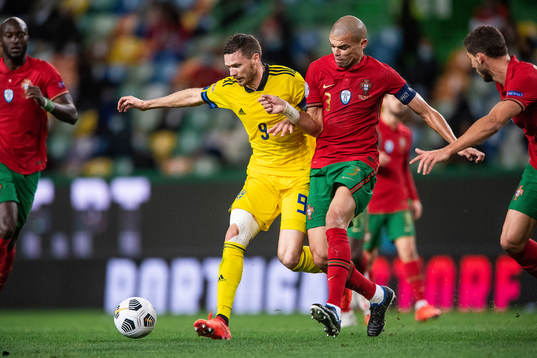 Marcus Berg of Sweden and Pepe of Portugal