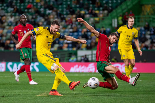 Marcus Berg of Sweden and Ruben Dias of Portugal