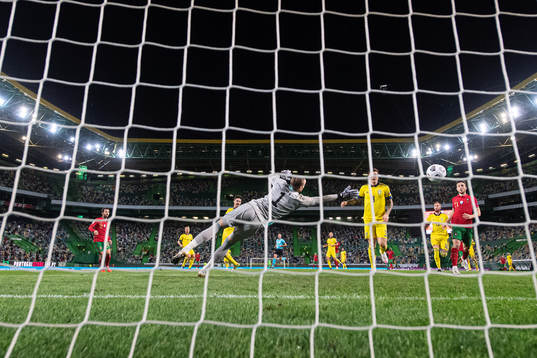 Bernardo Silva of Portugal scores 1-0 behind goalkeeper