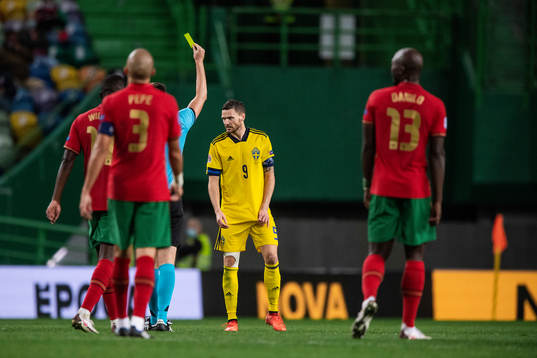 Marcus Berg of Sweden receives a yellow card