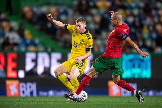 Dejan Kulusevski of Sweden and Pepe of Portugal