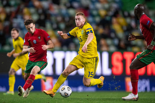 Diogo Jota of Portugal and Dejan Kulusevski of Sweden