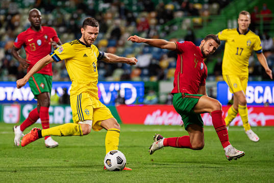 Marcus Berg of Sweden and Ruben Dias of Portugal
