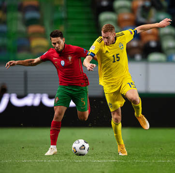 Raphael Guerreiro of Portugal and Dejan Kulusevski of Sweden
