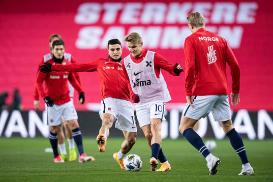 Mohamed «Moi» Elyounoussi and Martin Ødegaard of Norway