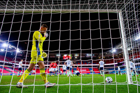 Goalkeeper Trevor Carson of Northern Ireland looks dejected