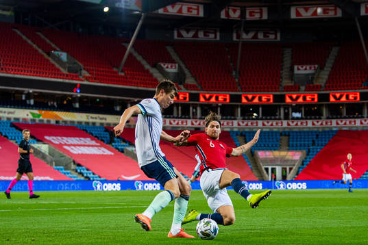 Paddy McNair of Northern Ireland and Stefan Strandberg of
