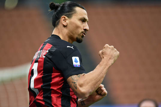 Zlatan Ibrahimovic of Milan celebrates scoring his first