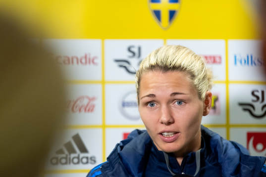 Goalkeeper Jennifer Falk is being interviewed