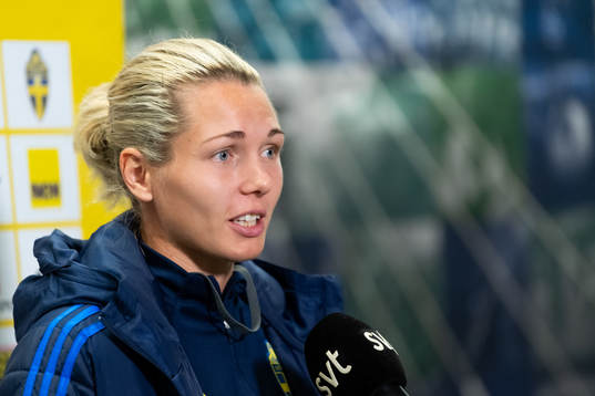 Goalkeeper Jennifer Falk is being interviewed
