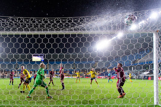 goalkeeper Sofja Nesterova of Latvia watch as the 7-0 goal