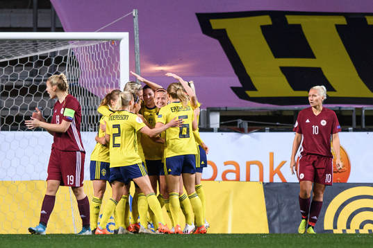 Players of Sweden celebrate the 1-0 goal by Lina Hurtig
