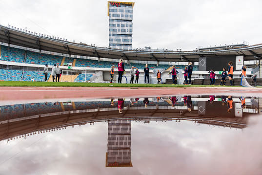 Players reflected in water