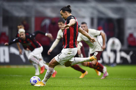 Zlatan Ibrahimovic of Milan scores the 3-2 goal with a