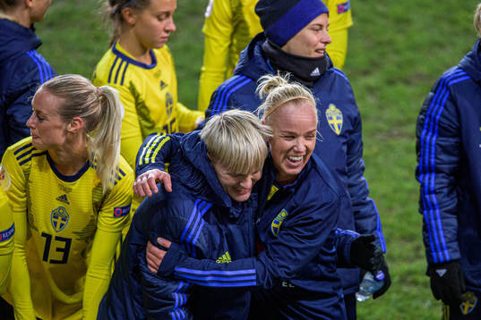 Nilla Fischer and Caroline Seger of Sweden celebrate