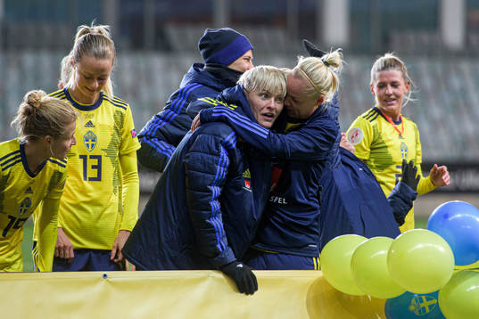 Nilla Fischer and Caroline Seger of Sweden celebrate