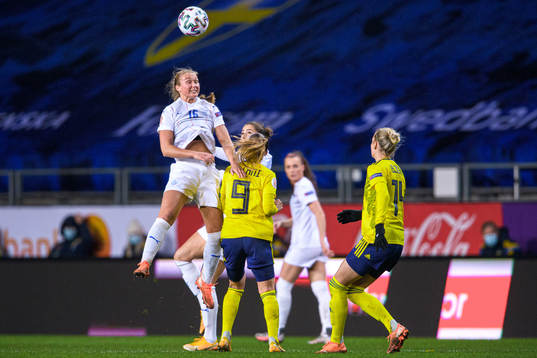 Elín Metta Jensen of Iceland and Kosovare Asllani of Sweden