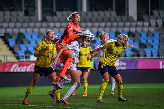 Goalkeeper Jennifer Falk of Sweden and Elín Metta Jensen