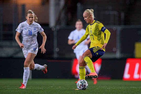 Elín Metta Jensen of Iceland and Caroline Seger of Sweden