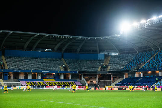 Players of Iceland and of Sweden kneel in support of the