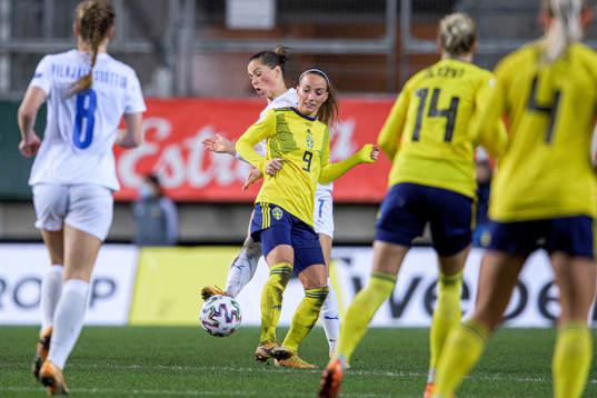 Kosovare Asllani of Sweden and Sara Björk Gunnarsdóttir