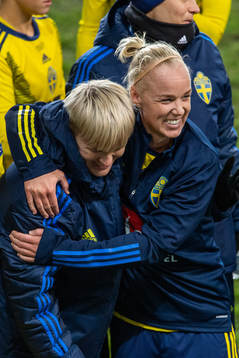Nilla Fischer and Caroline Seger of Sweden celebrate