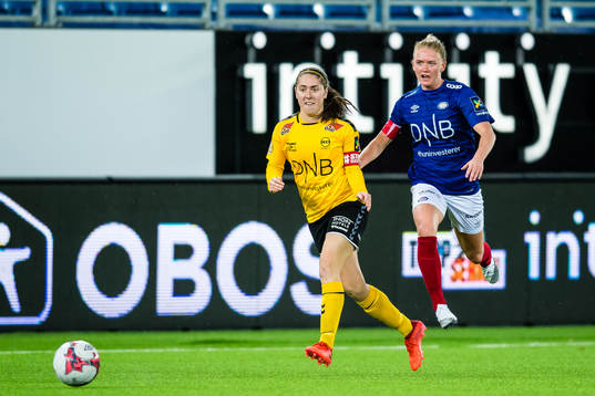 Karly Røstbakken of LSK Kvinner and Rikke Marie Madsen of