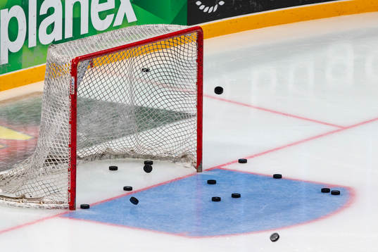 Warm up pucks in the net