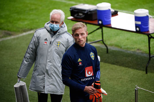 Anders Valentin, team doctor and goalkeeper Jacob Rinne of