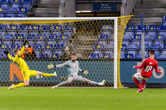 Alexander Bah of Denmark scores 2-0 behind Carl Starfelt
