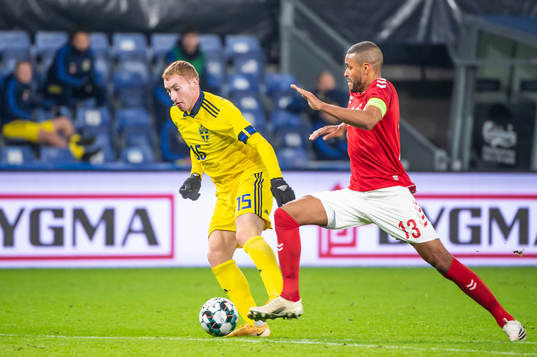 Dejan Kulusevski of Sweden and Mathias Jørgensen of Denmark