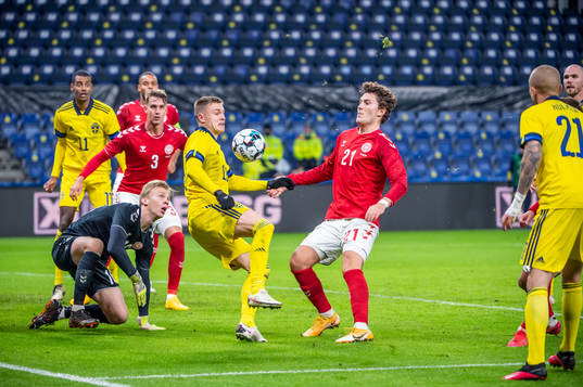 Mattias Svanberg of Sweden and Jonas Wind, goalkeeper