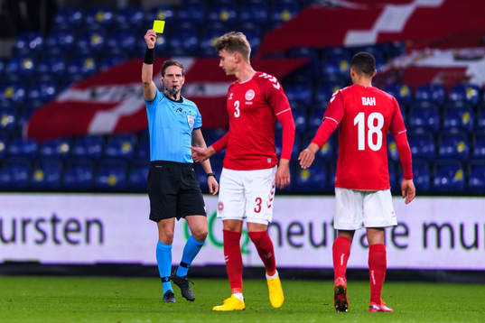 Andreas Maxsø of Denmark receives a warning from referee
