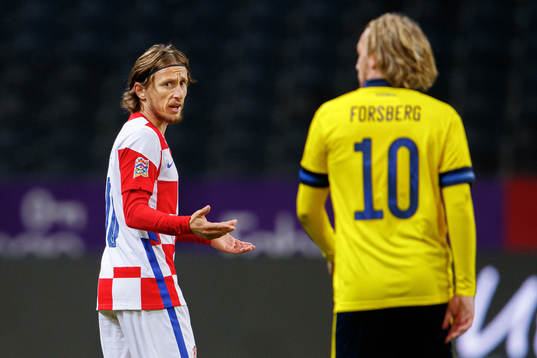 Luka Modric of Croatia and Emil Forsberg of Sweden