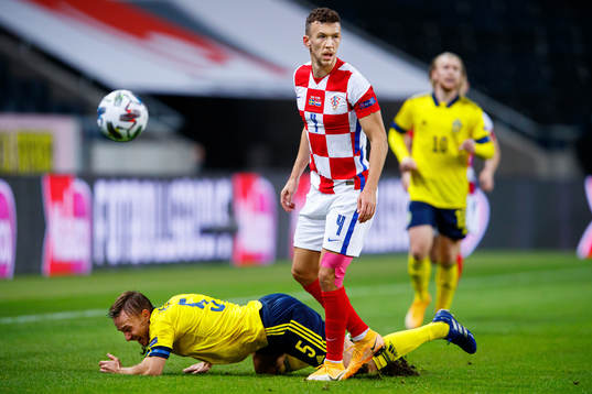 Pierre Bengtsson of Sweden and Ivan Perisic of Croatia