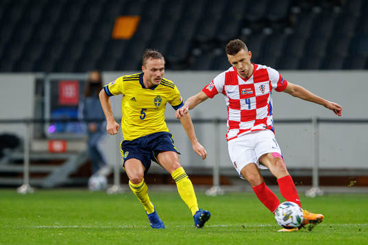 Pierre Bengtsson of Sweden and Ivan Perisic of Croatia