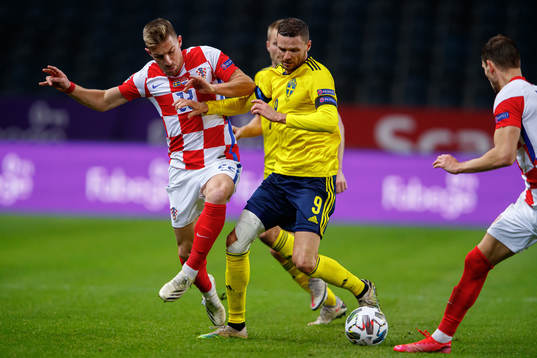 Dario Melnjak of Croatia and Marcus Berg of Sweden