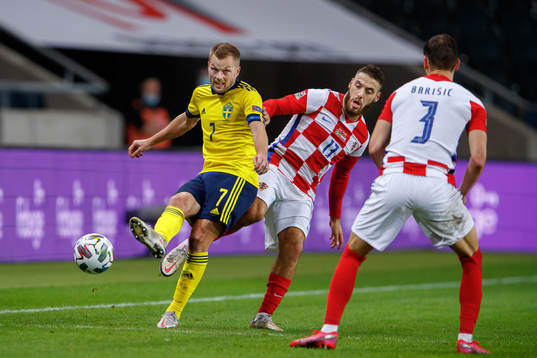 Sebastian Larsson of Sweden and Nikola Vlasic of Croatia